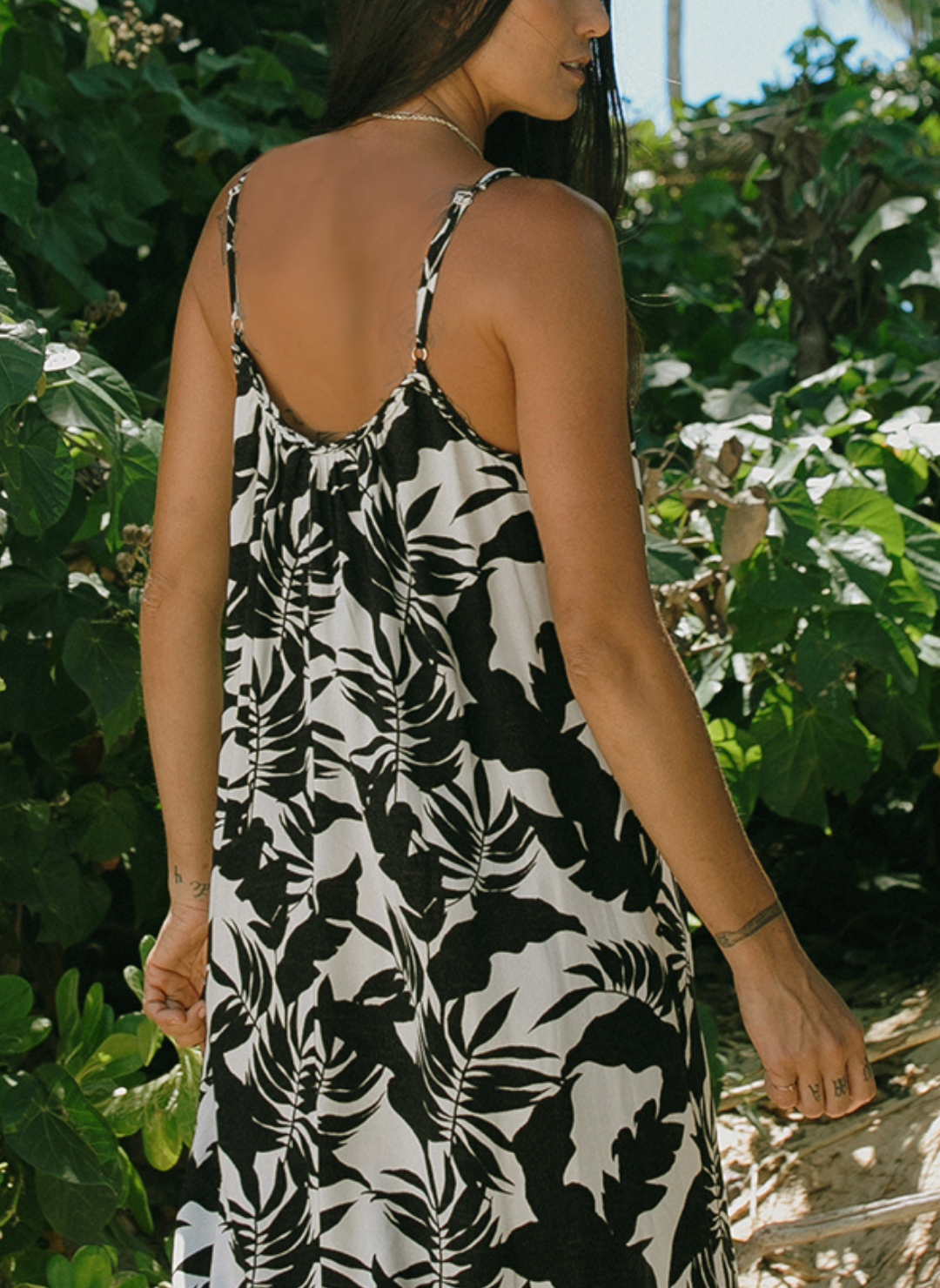 Back view of tropical print black and white maxi dress with braided straps for women