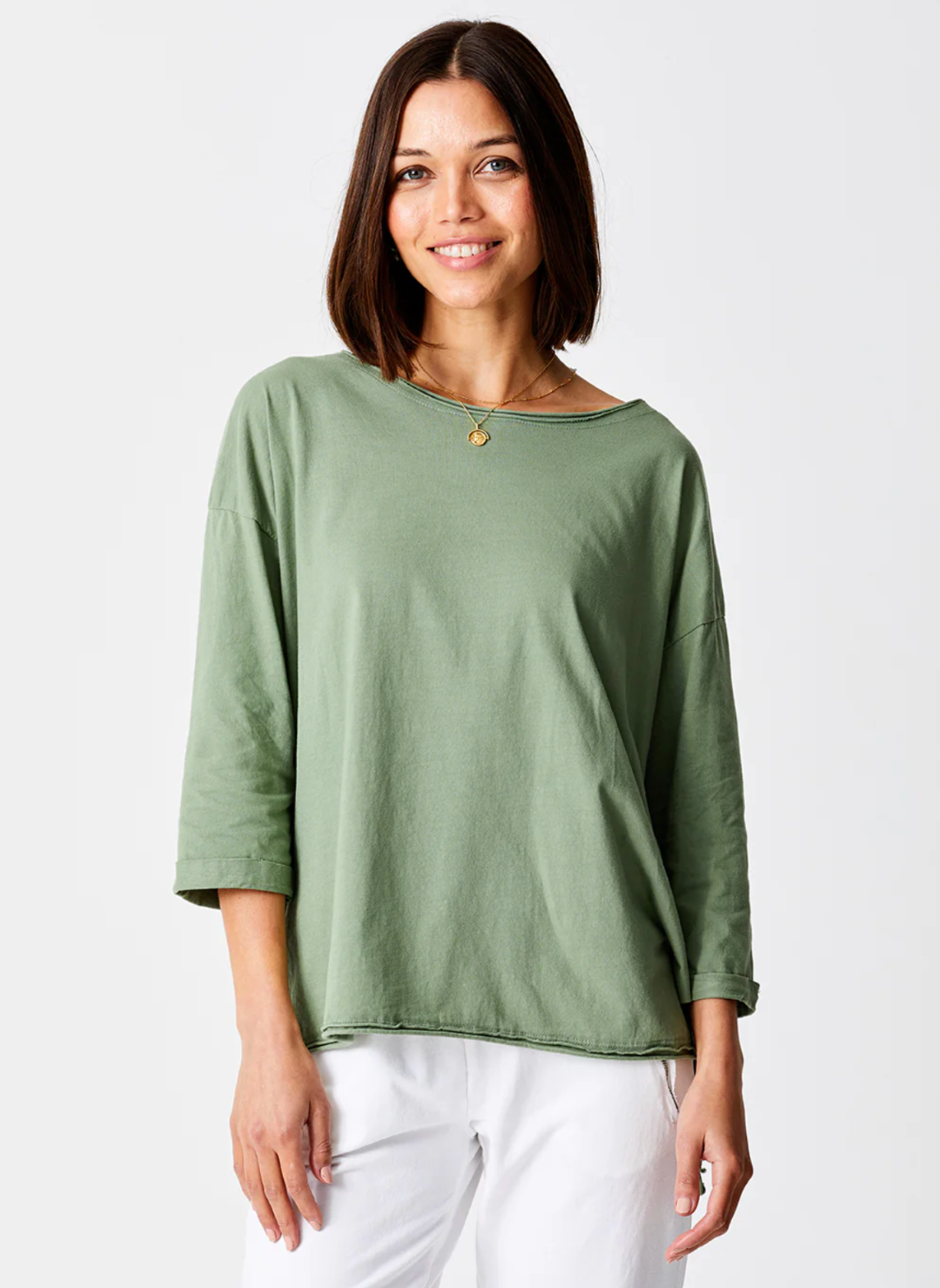 Front view of the model wearing the Suzy D Jardine Knit 3/4 Sleeve Top. Model is standing in front of a white background
