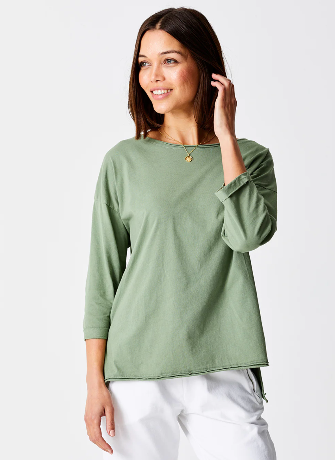 Front view of the model wearing the Suzy D Jardine Knit 3/4 Sleeve Top. Model is standing in front of a white background.