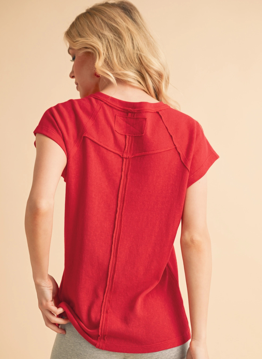back view of model wearing the Rock Soils Cap Crew Tee.