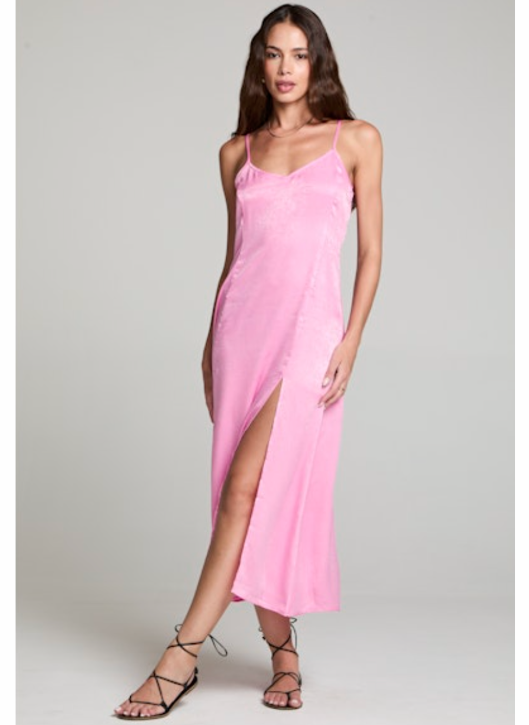 Full view of model wearing the Saltwater Luxe Midi Tank Dress paired with black sandals. Model is standing in front of grey background.