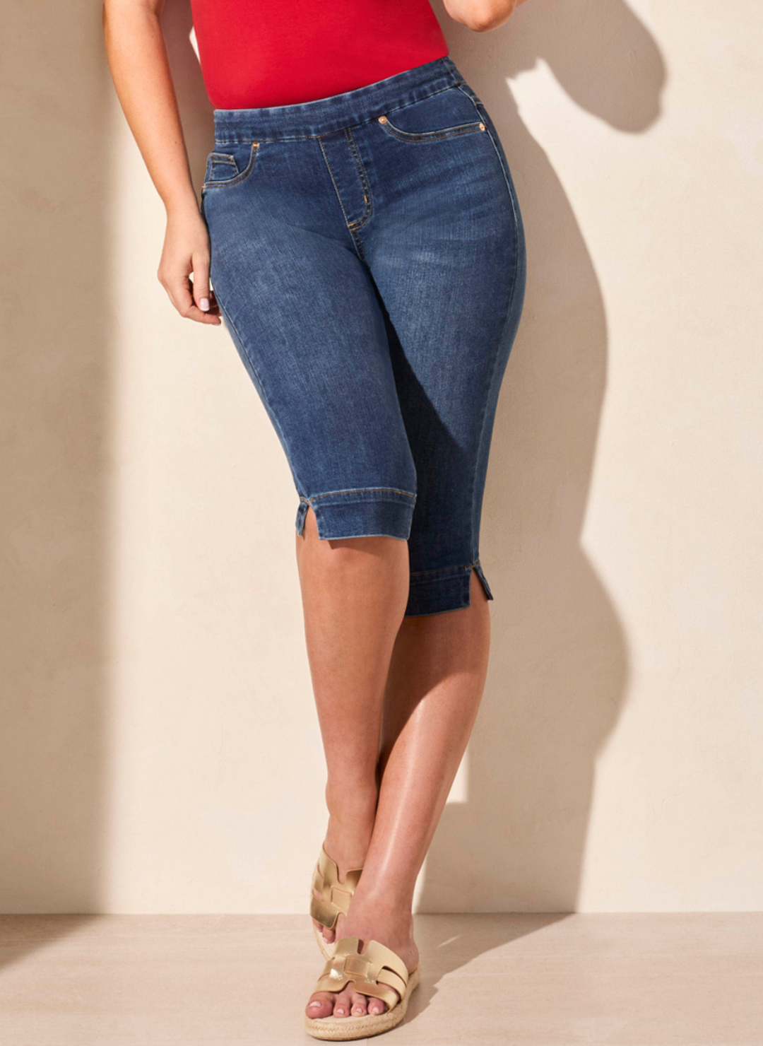 Stretch denim pull-on capri pants in classic indigo and jet black from Tribal, shown styled with sandals and casual tops, available at August Boutique Ripon.