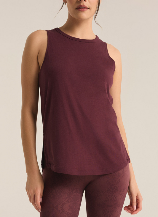 Model is showing the front of the burgundy tank paired with matching printed leggings.
