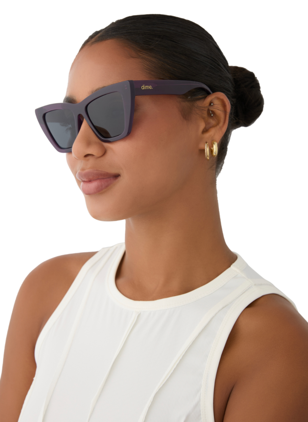 Image shows model wearing purple colored sunglasses portraying the side view.
