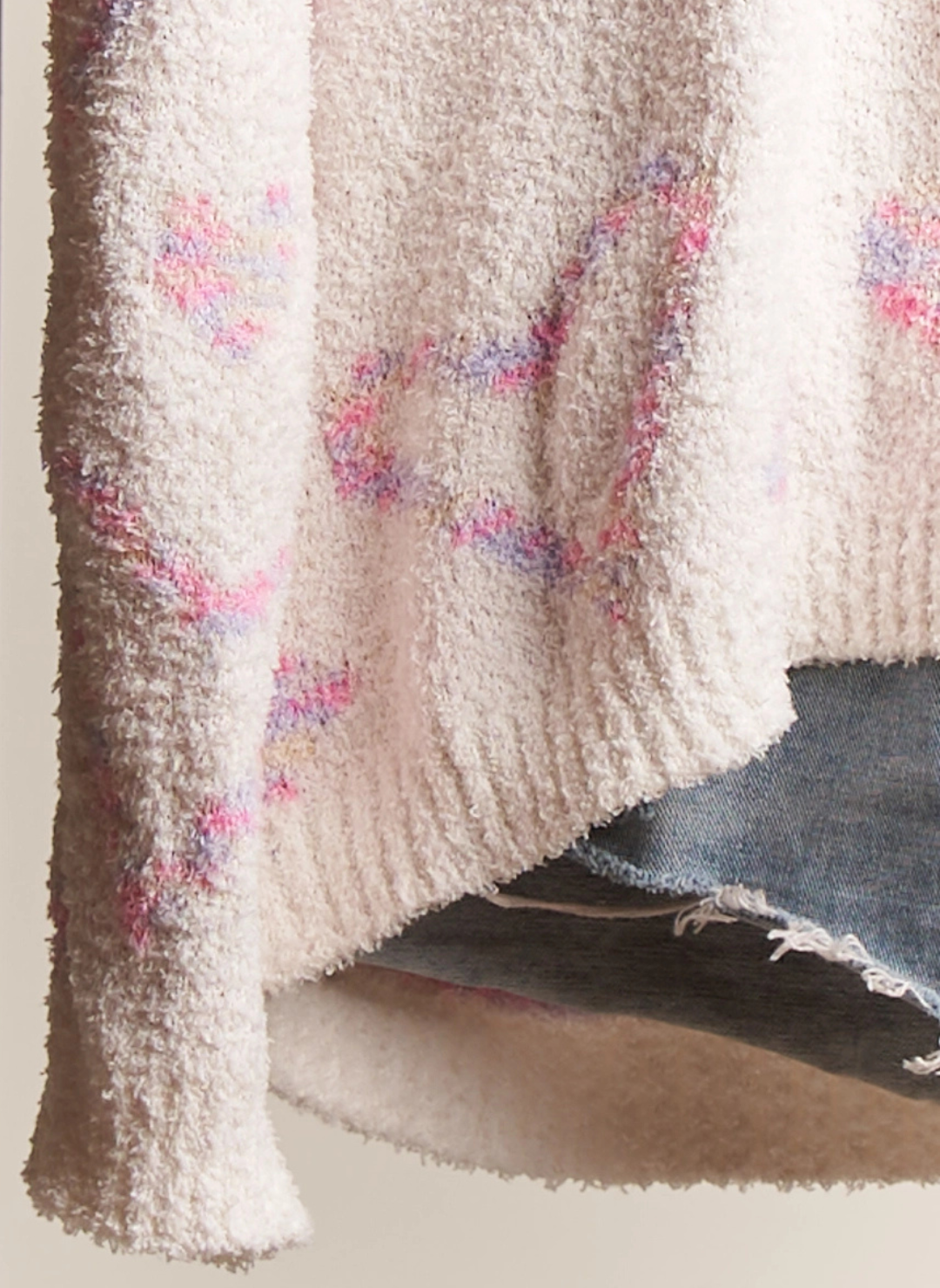 Up close view of the Sweet Heart Sweater in front of white background.
