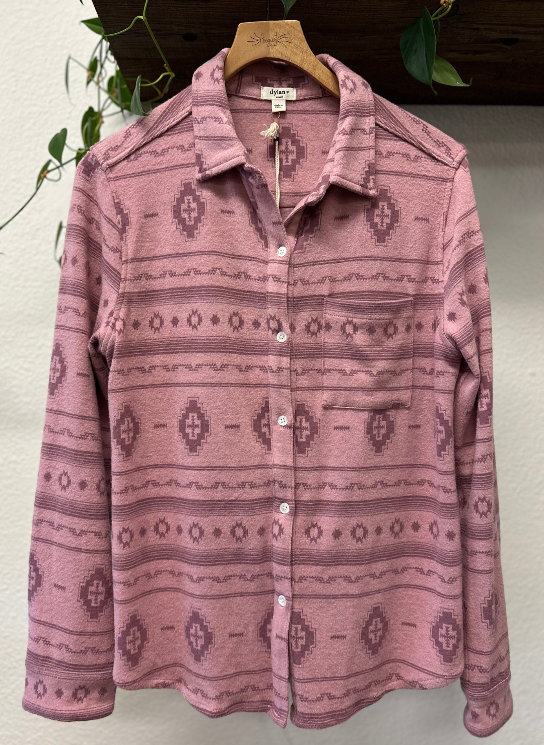 Dylan Pink Emma Brushed shirt on a hanger against a neutral background.  Southwest Print.