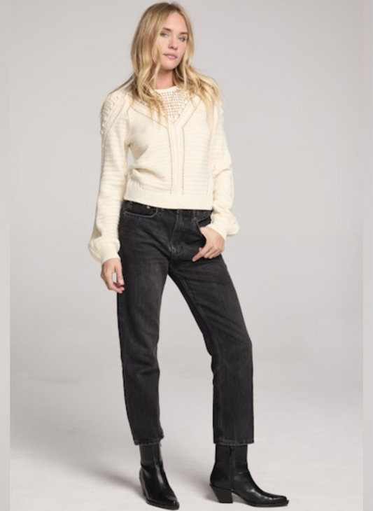 Model styled in Saltwater Luxe Gianny Sweater in cream with black jeans and boots for chic fall outfit