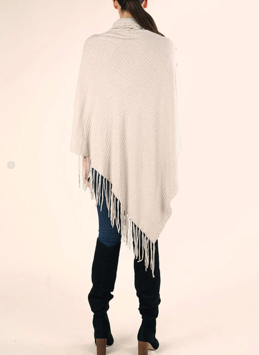 Back view of Lovestitch Cowl Neck Baby Cable Poncho showing draped fit and fringe hemline.