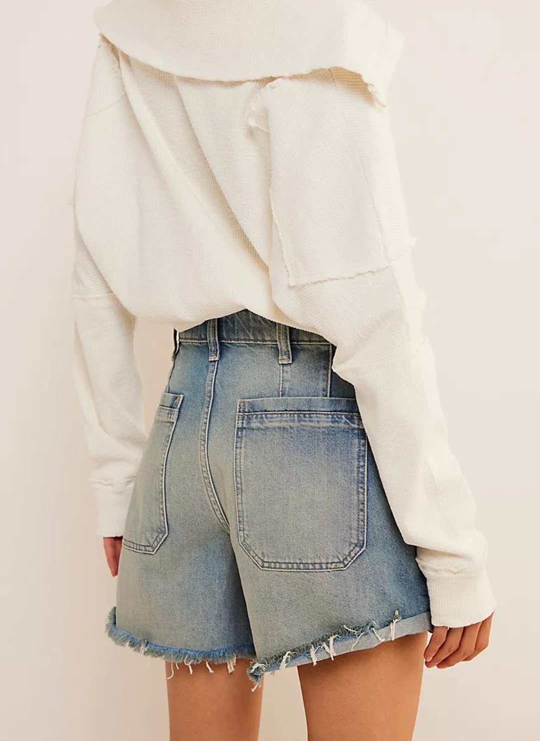 Back view of model wearing a Palmer Short FP with cropped sweatshirts. White background.