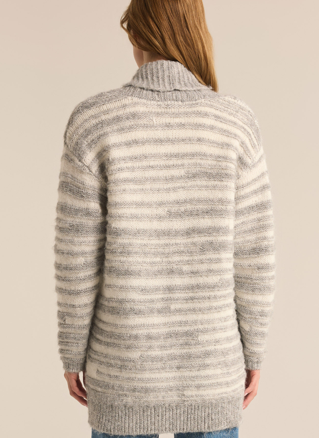 Model wearing Level Up Cardigan facing away providing a back view of the cardigan.