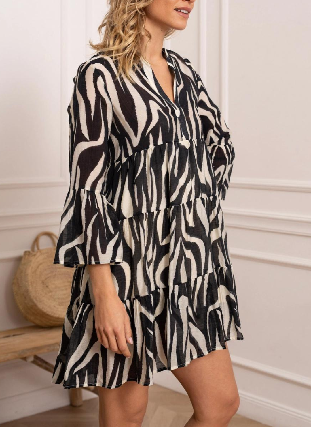 Front view of model wearing black and white St. Tropez Printed Silk Dress. Model has one hand on hip one by side. White background.