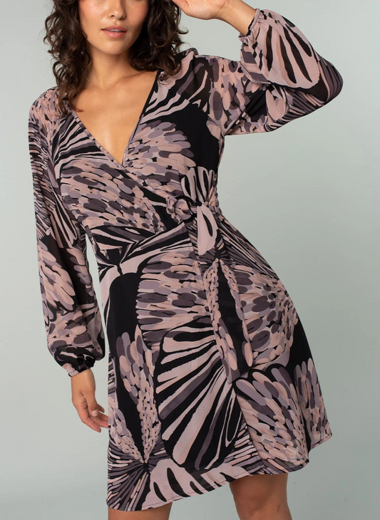 Model is posing with one hand on her head
