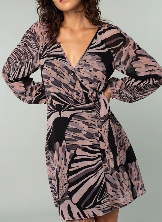 Model is showing the front of the abstract print mini dress