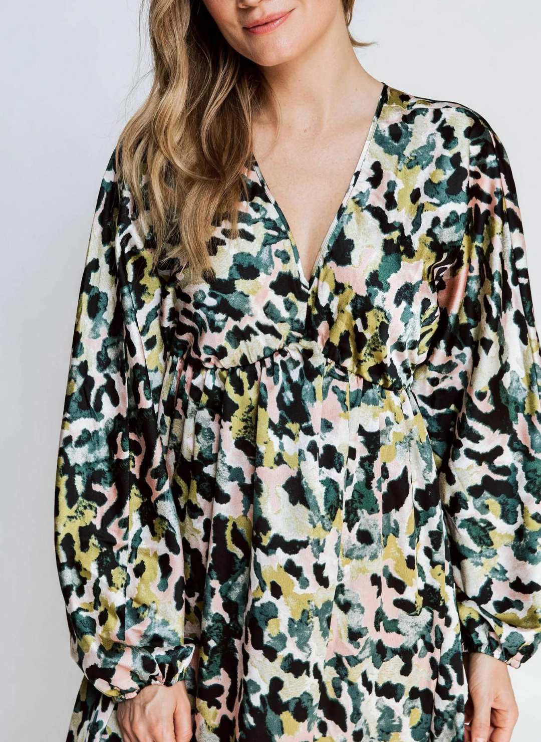 Up close view of model wearing the ZHRILL Reflection Printed Dress. White background.