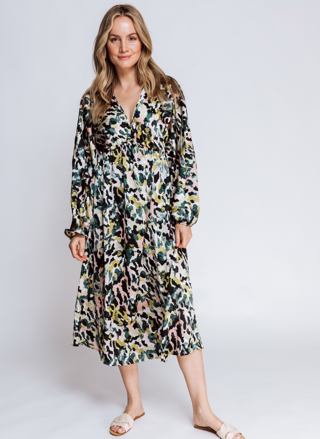 Full view of model wearing the ZHRILL Reflection Printed Dress with white sandals. White background.