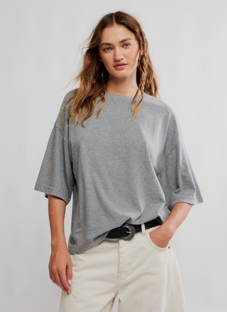 Model wearing Free People Basic B Tee in heather grey side view — August Boutique.