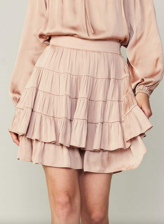 Model wearing light pink Shake it Off Skirt with ruffles.