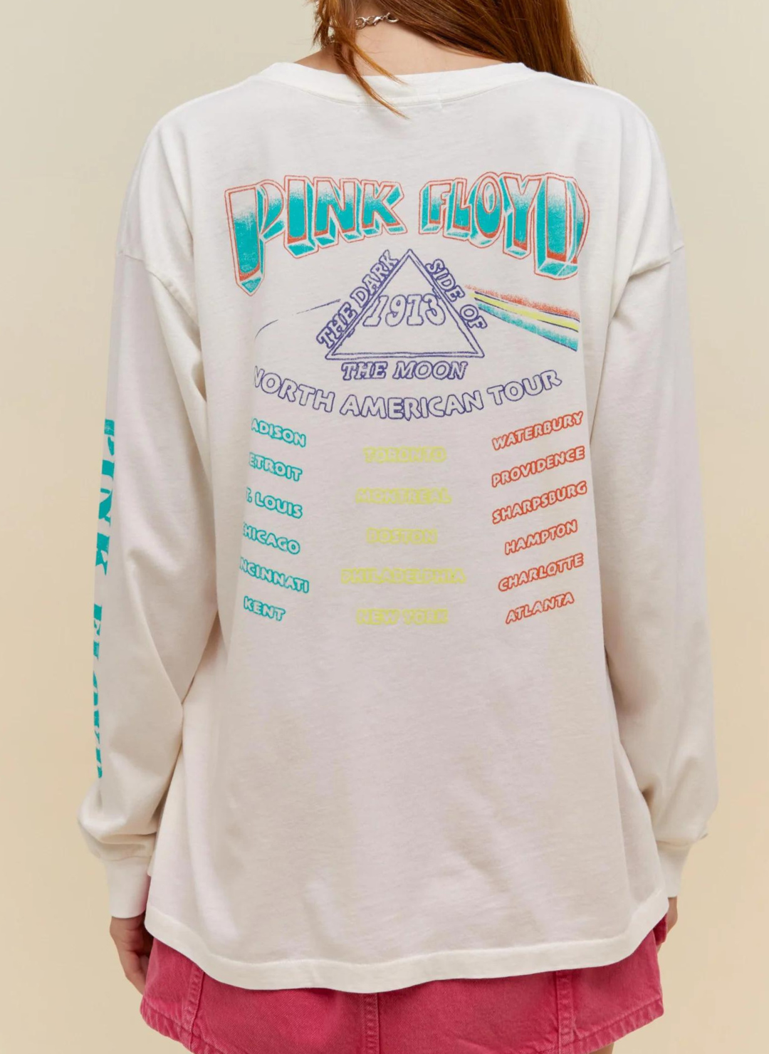 Back view of model wearing white Pink Floyd Tee with "The Dark Side of the Moon" North American Tour locations graphic.