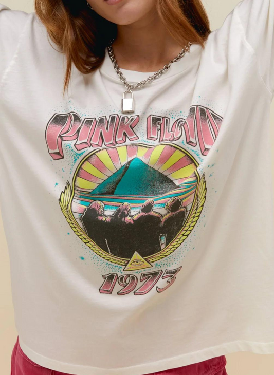 Model wearing white Pink Floyd Tee with vintage Pink Floyd 1973 graphic on the front and along the sleeve.