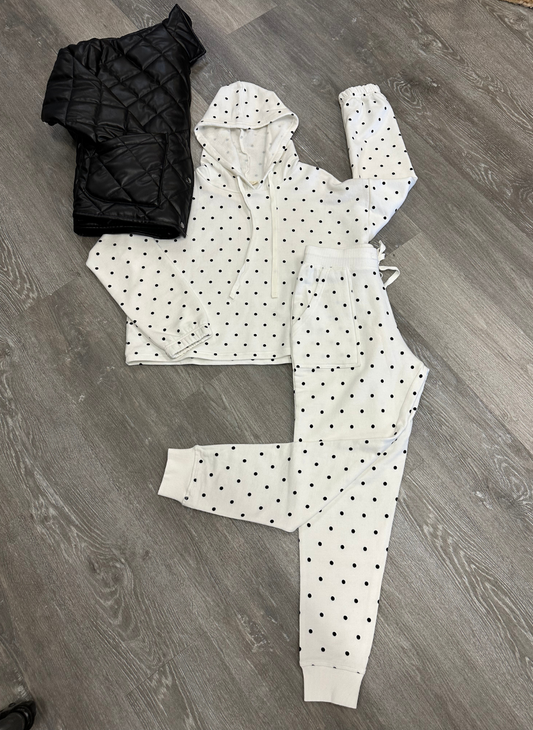 Front view of the LS Polka Dot Princess Top and pants showing the polka dots and cuffs at the bottom of the pants. Accessorized with a black faux leather bomber jacket. 