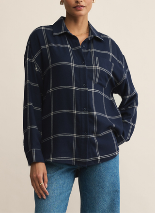 Front view of Z Supply Navy River Plaid Button Up featuring collared neckline, card pocket, and classic navy plaid pattern