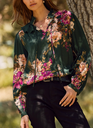 Front view of Oddi Garden Blast Blouse in green multi featuring floral print, ruffled neckline, and feminine tie detail