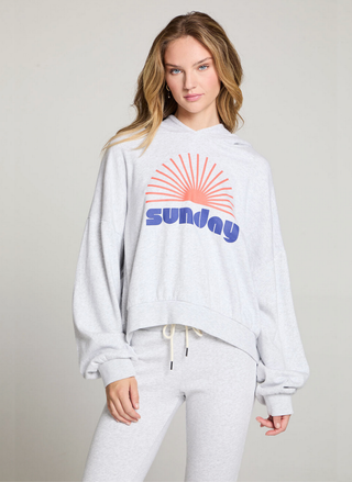 Front view of Chaser Sunday Sweatshirt in light heather grey featuring retro sunrise design and roomy sleeves