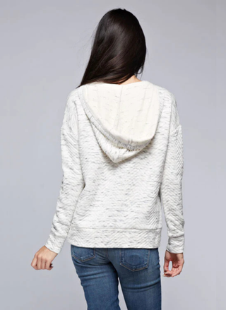 Back view of Lovestitch gray quilted hoodie showing weathered texture and relaxed pullover silhouette