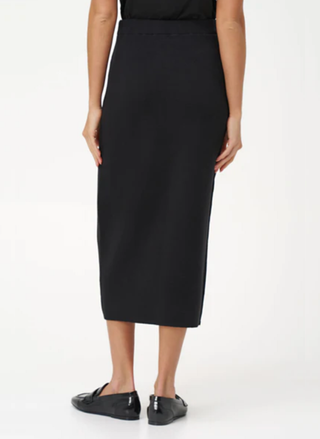 Back view of M Made in Italy black skirt showing white line accent and elegant comfortable silhouette