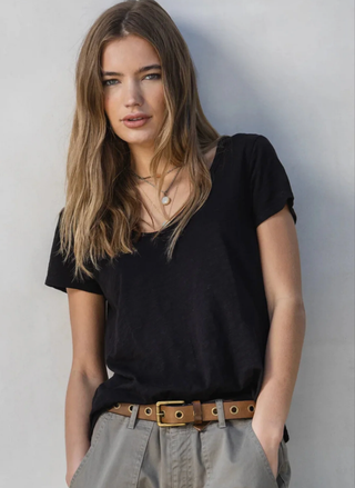 Close-up detail of slub cotton texture and v-neckline on Dylan Softness black tee.