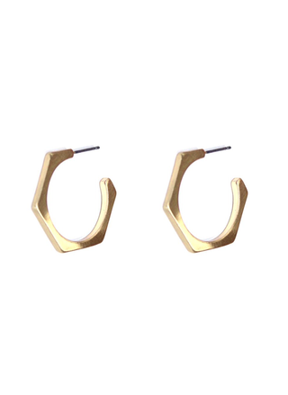 Gold hoop earrings on a white background