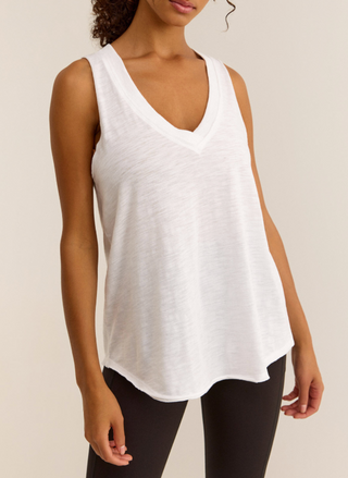 Model wearing Feelin' Good Tank with v-neckline, rib trim, and curved hem in white.