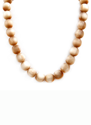 Necklace with wooden beads on a white background