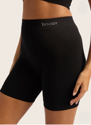 Women’s black BOODY bamboo smoothing shorts—upper thigh length with flat-seam gusset for comfort under dresses and skirts.