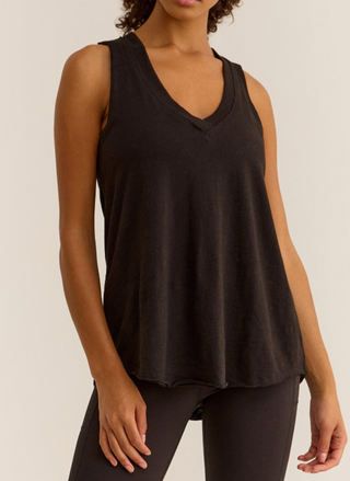 Model wearing Feelin' Good Tank with v-neckline, rib trim, and curved hem in black.