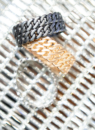 Image shows 3 double row linked bracelets. The bracelets are brushed gold, brushed silver, and gunmetal.