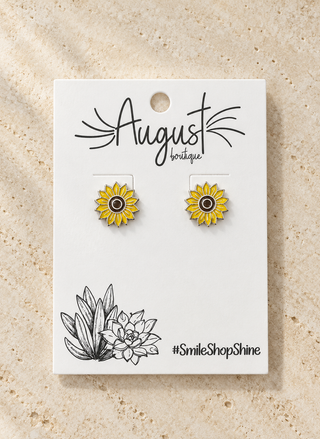 GANZ yellow sunflower enamel stud earrings on an August Boutique earring card