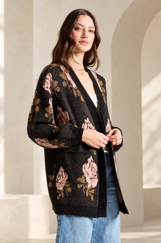 Saltwater Luxe Stari hip-length cardigan sweater in black with a neutral floral pattern