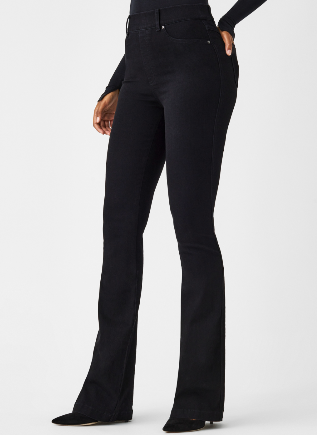 Full length of front view of SPANX black denim pants with slight flare at the bottom.