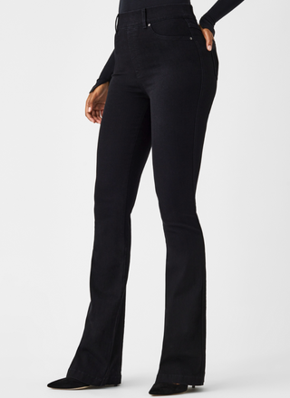 Full length of front view of SPANX black denim pants with slight flare at the bottom.