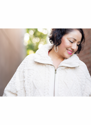 Close-up of the ivory Dylan So Cozy plush cable jacket with high collar and front zipper