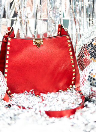 Image showing an up close view of the Red - The D'Vil Stud Bag.
