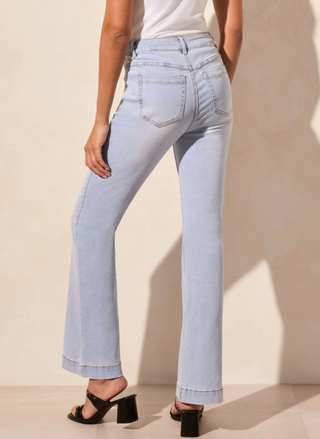full front view of the model wearing the Tribale Audrey Flare Jeans. Model is standing in front of a white background.
