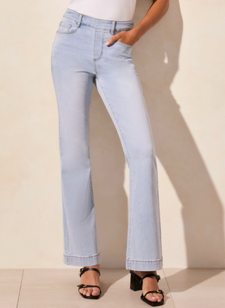 full front view of the model wearing the Tribale Audrey Flare Jeans. Model is standing in front of a white background.