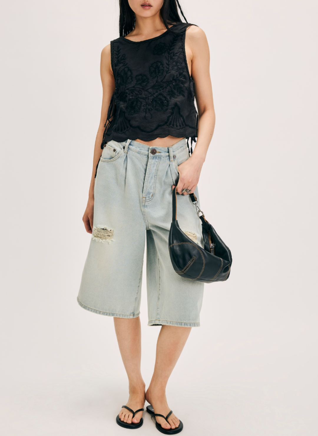Model is wearing the Free People Faded Gardens Cotton Tank