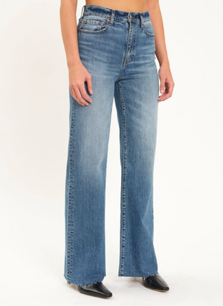 front view of model wearing the DAZE Far Out High Rise Wide Leg Denim