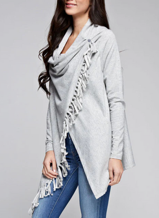 Side view of Lovestitch gray wrap showing fringe detail and flattering draped silhouette