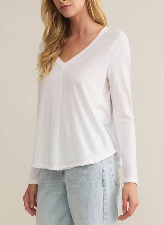 Front view of model wearing white long sleeve Vail LS Tee.