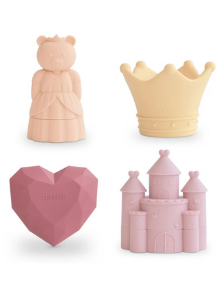 Mushie Princess Mold Free Bath Play Set 4 Pack featuring four pastel food-grade silicone bath toys: a pink princess bear, cream crown, faceted pink heart gem, and pink castle