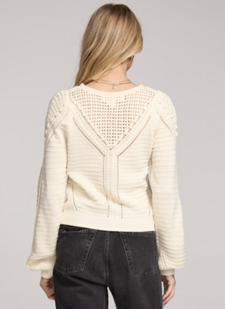 Back view of Saltwater Luxe Gianny Sweater in cream featuring open-stitch detail across shoulders and back.